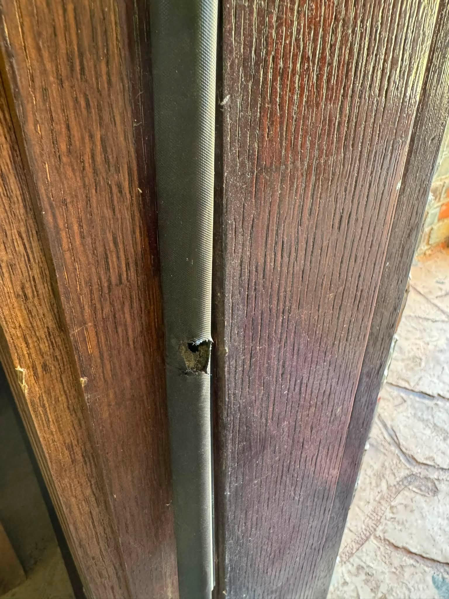 Damaged door weatherstripping needing weatherization repair in Mustang, OK